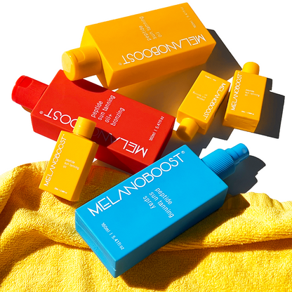Melanoboost_Peptide_Sun_Tan_Accelerator_Spray_Oils on yellow towel