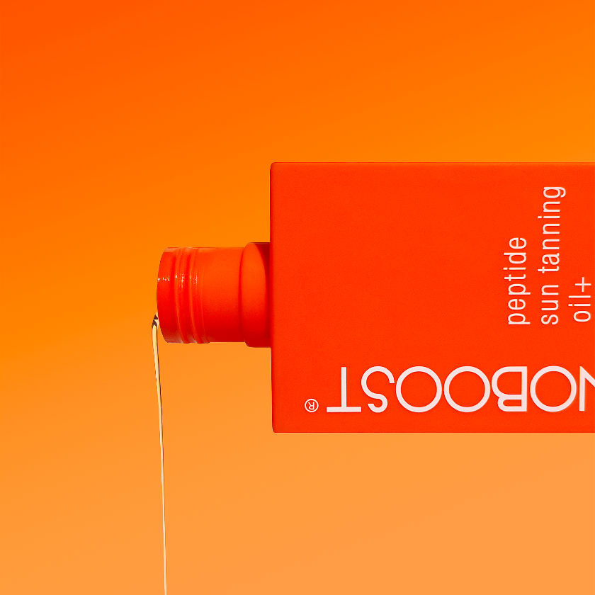 Orange_bottle_of_Melanoboost Peptide_Sun_Tanning_Oil_Bronzing_on_a_lighter_orange_background