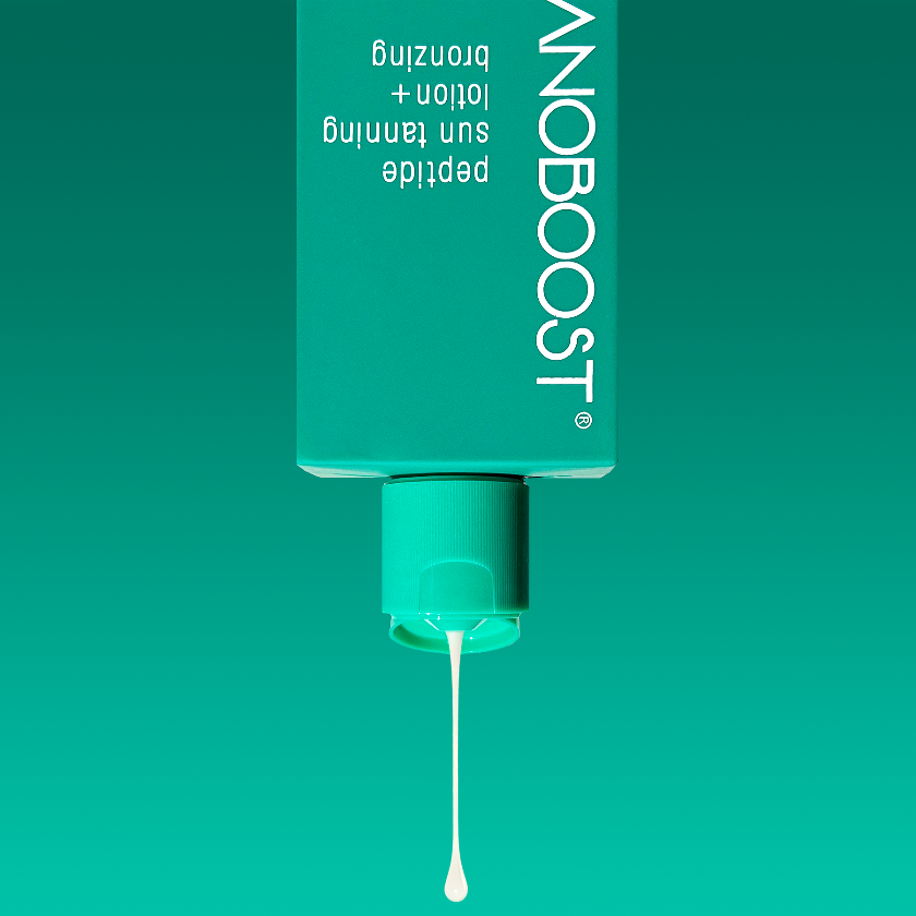 bottle_of_Melanoboost_Peptide_Sun_Tan_Accelerator_Lotion_Bronzing_on_a_green_background