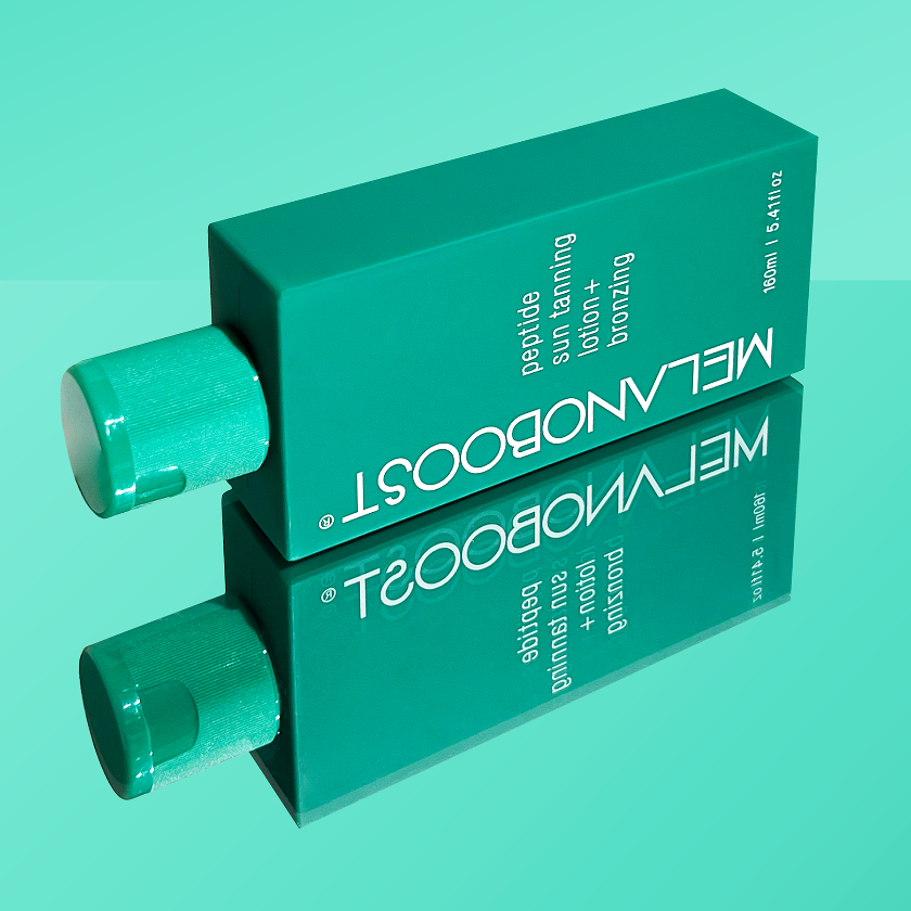 bottle_of_Melanoboost_Peptide_Sun_Tan_Accelerator_Lotion_Bronzing_on_a_green_reflective_background