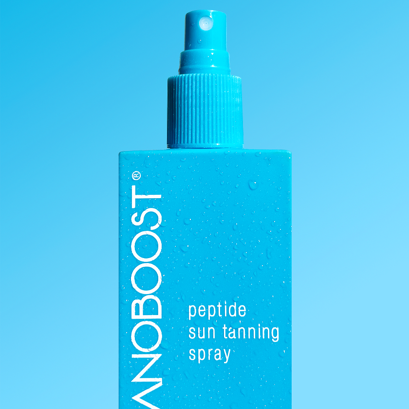 bottle_of_Melanoboost_Peptide_Sun_Tanning_Spray_on_a_aqua_background
