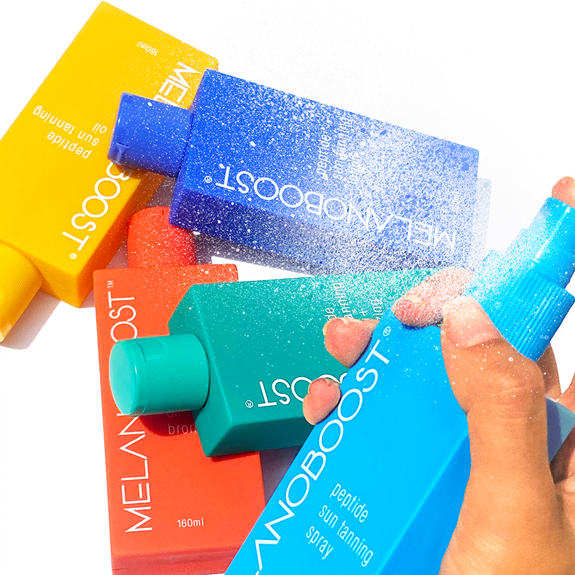 5_colorful_bottles_of_MELANOBOOST_Peptide_Sun_Tan_Accelerator_Oils_Lotions_Spray_on_a_white_background
